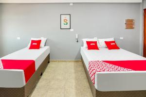 Postel nebo postele na pokoji v ubytování OYO Hotel Boneville, São Paulo