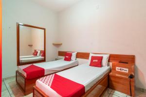 Postel nebo postele na pokoji v ubytování OYO Hotel Dom Pedro, São Paulo