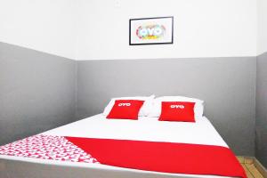 Ένα ή περισσότερα κρεβάτια σε δωμάτιο στο OYO Hotel Brás