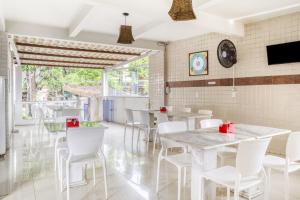 TV a/nebo společenská místnost v ubytování OYO Praia Hotel Recanto do Tomé - Salvador + 20 fotografií