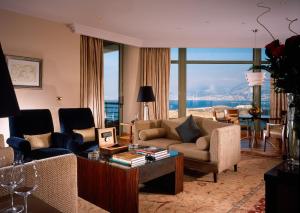 a living room with a couch and chairs and a table at Phoenicia Residence in Beirut