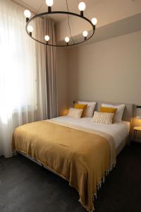 Postel nebo postele na pokoji v ubytování Boutique Hotel Kint