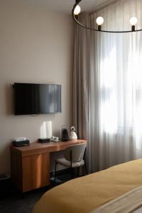 TV a/nebo společenská místnost v ubytování Boutique Hotel Kint