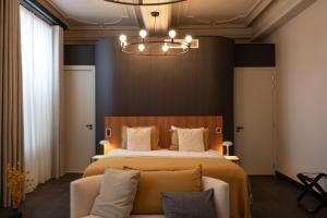 Postel nebo postele na pokoji v ubytování Boutique Hotel Kint