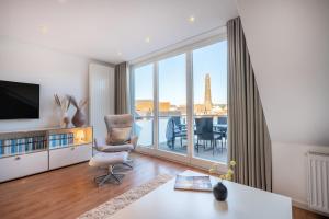 a living room with a view of the eiffel tower at Wohnung Strand Vier in Borkum