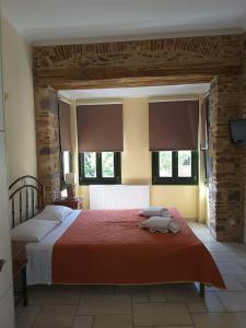 Ένα ή περισσότερα κρεβάτια σε δωμάτιο στο Frourio Apartments