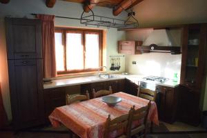 a kitchen with a table with a bowl on it at La casetta di Eli in Roddino