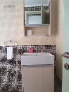Koupelna v ubytování Frourio Apartments