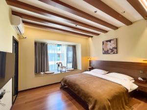 Lova arba lovos apgyvendinimo įstaigoje Luyu Shijian B&B