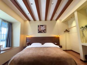 Lova arba lovos apgyvendinimo įstaigoje Luyu Shijian B&B