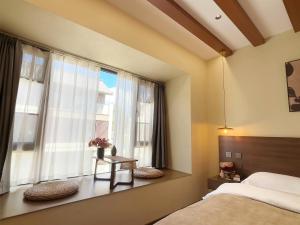 Lova arba lovos apgyvendinimo įstaigoje Luyu Shijian B&B