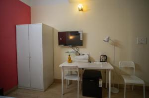 Kuchyň nebo kuchyňský kout v ubytování Siliguri Club