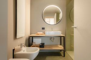 a bathroom with a sink and a mirror at Villa del Brolo - Famiglia Furia in Mezzane di Sotto +33 photos