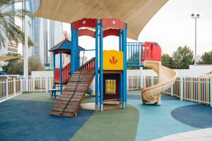 a playground with a slide in a building at Radisson Blu Hotel & Resort, Abu Dhabi Corniche in Abu Dhabi +162 photos