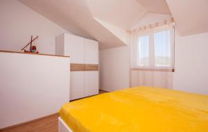 Postel nebo postele na pokoji v ubytování Apartments Tresan