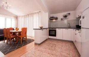 Kuchyň nebo kuchyňský kout v ubytování Apartments Tresan