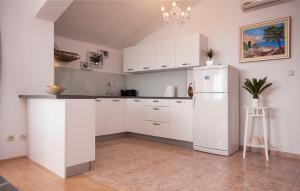 Kuchyň nebo kuchyňský kout v ubytování Apartments Tresan