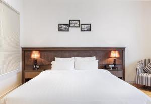 Ένα ή περισσότερα κρεβάτια σε δωμάτιο στο Collection O Le Grand Hanoi hotel - The Tryst