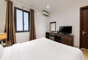 Μια τηλεόραση ή/και κέντρο ψυχαγωγίας στο Collection O Le Grand Hanoi hotel - The Tryst