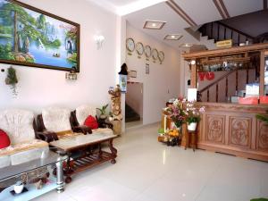 a waiting room at a dermatologists office with a large screen at Episode 11 Hostel Sukhumvit in Bangkok