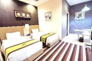 Postel nebo postele na pokoji v ubytování Capital O 75451 Podstel Hostel Bangkok + 32 fotografií