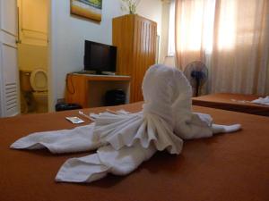 Postel nebo postele na pokoji v ubytování Marian Palazz Hotel