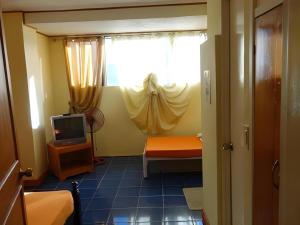 TV a/nebo společenská místnost v ubytování Marian Palazz Hotel