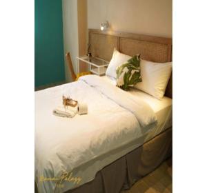 Postel nebo postele na pokoji v ubytování Marian Palazz Hotel