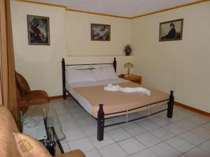 Postel nebo postele na pokoji v ubytování Marian Palazz Hotel
