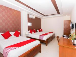 Postel nebo postele na pokoji v ubytování Hotel O Hotel Ramai