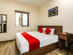 Postel nebo postele na pokoji v ubytování Hotel O Hotel Ramai