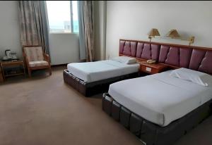 Postel nebo postele na pokoji v ubytování Hotel O Hotel Ramai