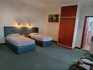 Postel nebo postele na pokoji v ubytování Hotel O Hotel Ramai
