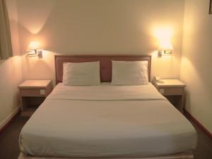 Postel nebo postele na pokoji v ubytování Hotel O Hotel Ramai