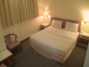 Postel nebo postele na pokoji v ubytování Hotel O Hotel Ramai