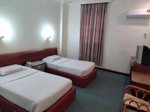 Postel nebo postele na pokoji v ubytování Hotel O Hotel Ramai