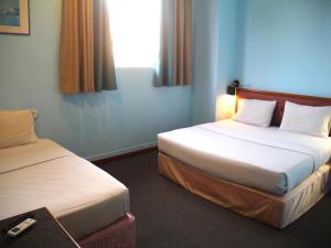 Postel nebo postele na pokoji v ubytování Hotel O Hotel Ramai