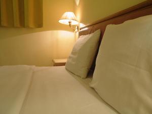 Postel nebo postele na pokoji v ubytování Hotel O Hotel Ramai