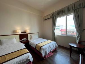 Postel nebo postele na pokoji v ubytování OYO 91037 Atari Inn