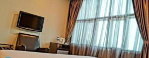 Μια τηλεόραση ή/και κέντρο ψυχαγωγίας στο Capital O Rail Hotel