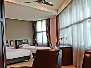 Ένα ή περισσότερα κρεβάτια σε δωμάτιο στο Capital O Rail Hotel