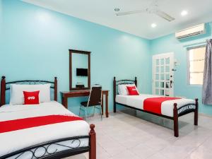 Postel nebo postele na pokoji v ubytování OYO 44094 Bangi Lanai Hotel
