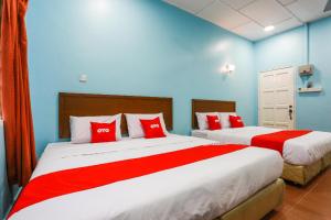 Postel nebo postele na pokoji v ubytování OYO 44094 Bangi Lanai Hotel