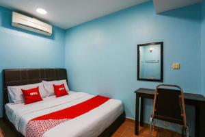 Postel nebo postele na pokoji v ubytování OYO 44094 Bangi Lanai Hotel
