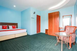Postel nebo postele na pokoji v ubytování OYO 44094 Bangi Lanai Hotel