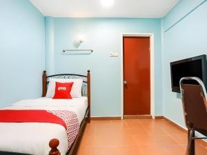 Postel nebo postele na pokoji v ubytování OYO 44094 Bangi Lanai Hotel