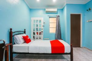Postel nebo postele na pokoji v ubytování OYO 44094 Bangi Lanai Hotel