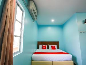 Postel nebo postele na pokoji v ubytování OYO 44094 Bangi Lanai Hotel