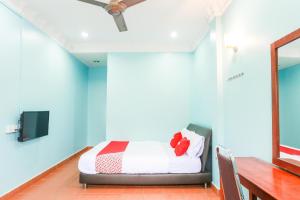 Postel nebo postele na pokoji v ubytování OYO 44094 Bangi Lanai Hotel