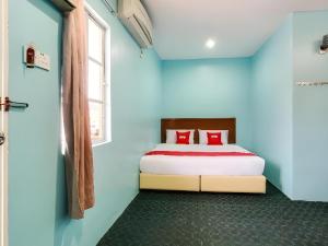 Postel nebo postele na pokoji v ubytování OYO 44094 Bangi Lanai Hotel